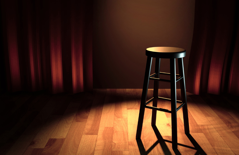 Stand up comedy stage with a lone stool.